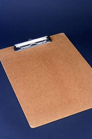 Empty clipboard on a black backgroundの写真素材