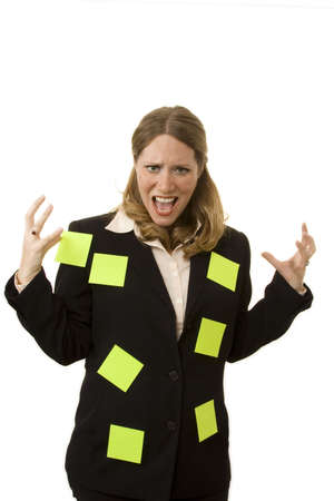 Businesswoman on white looking stressed out with suit covered in sticky notes