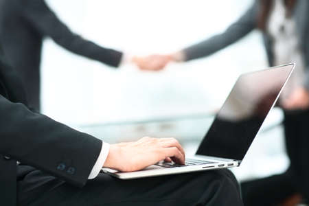 Business partnership meeting concept. Image businessmans handshake. Successful businessmen handshaking after good deal. Horizontal, blurred backgroundの写真素材