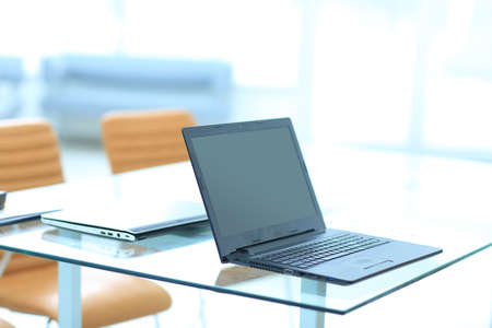 Laptop on the table in modern office