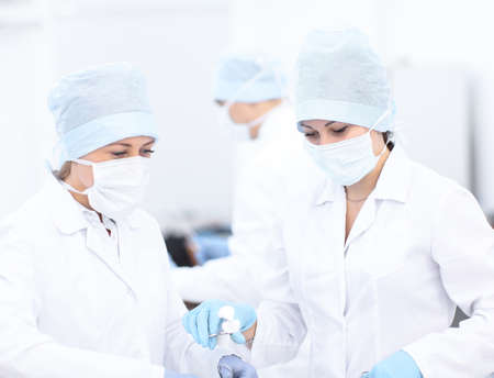 Doctor and her assistent during operationの写真素材