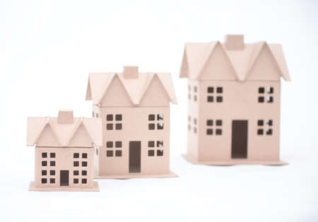 The concept, the house from the goffered cardboard, isolated on a whiteの写真素材