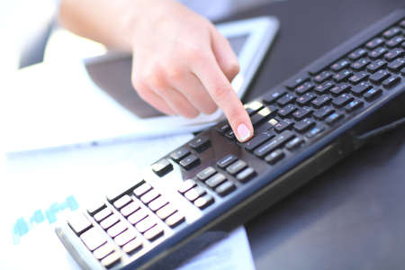 Hands of an office woman typing