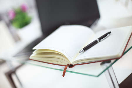 Pencil and notebook on laptop for business concept.の写真素材