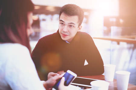 Young woman showing phoneの写真素材