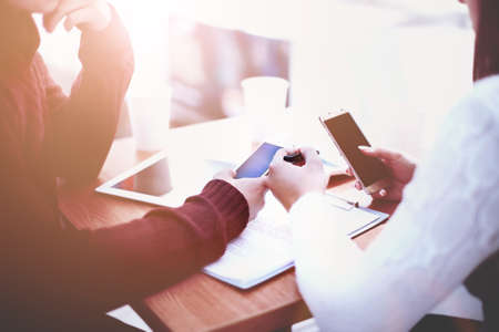 Young woman showing phoneの写真素材