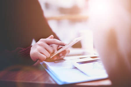 Close up of a man using mobile smart phoneの写真素材