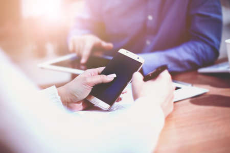 Close up of a man using mobile smart phoneの写真素材
