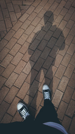The man who stood still in his shadowの写真素材