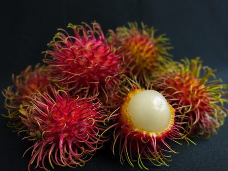Rambutan fruit on a black backgroundの写真素材
