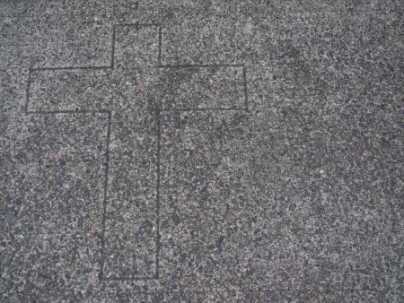Religious cross etched in aggregate surfaceの写真素材