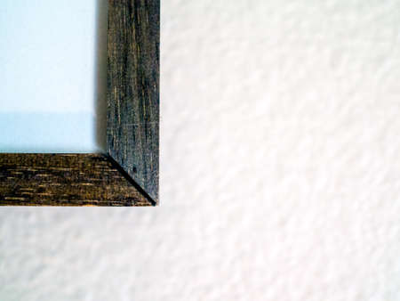 Corner of wooden frame, gapped miter