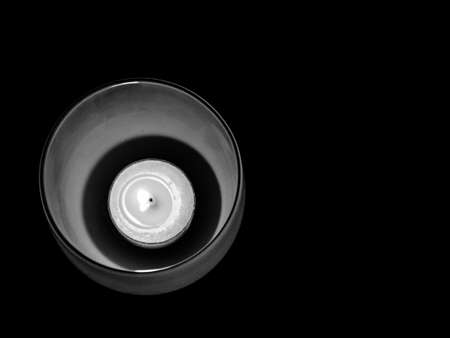 Monochrome, overhead close-up of lit tea lightの写真素材