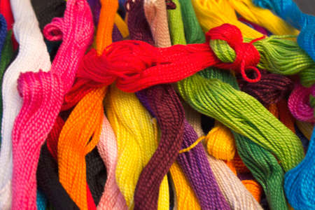 This is a photograph of colorful cotton threads background