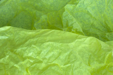 This is a photograph of Yellow tissue paper backgroundの写真素材