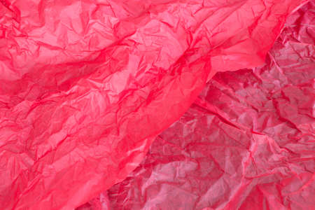 This is a photograph of Red tissue paper background