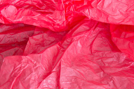 This is a photograph of Red tissue paper background