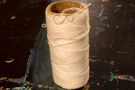 This is a photograph of a spool of White thread