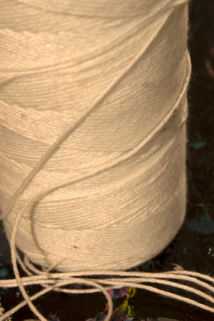 This is a photograph of a spool of White thread