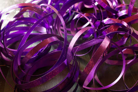 This is a photograph of Purple metallic Ribbonsの写真素材