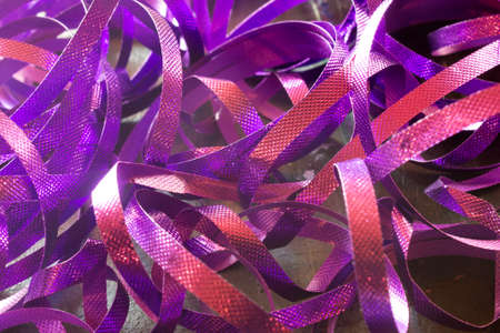 This is a photograph of Purple metallic Ribbonsの写真素材