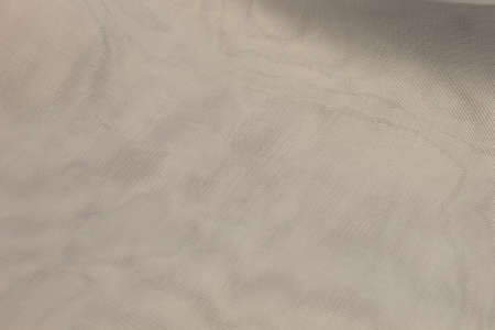 This is a photograph of Silver polyester fabric