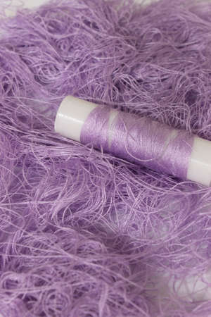 This is a photograph of Pastel Purple sewing thread roll background