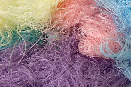 This is a photograph of Pastel Colored Sewing thread rolls backgroundの写真素材
