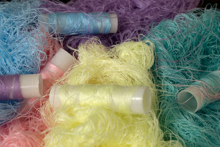 This is a photograph of Pastel Colored Sewing thread rolls backgroundの写真素材