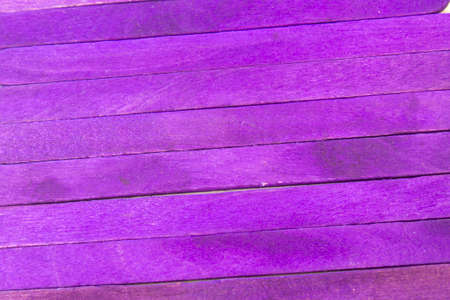 This is a photograph of Purple colored popsicle sticks backgroundの写真素材