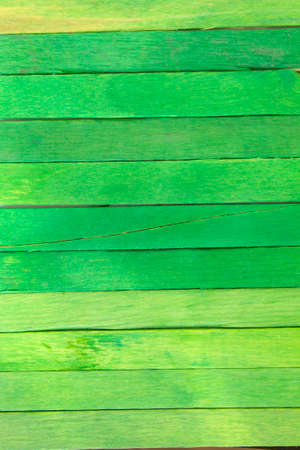 This is a photograph of Green colored popsicle sticks backgroundの写真素材
