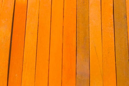 This is a photograph of Orange colored popsicle sticks backgroundの写真素材