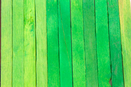 This is a photograph of Green colored popsicle sticks backgroundの写真素材