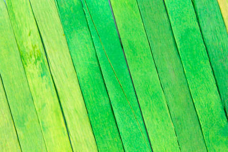 This is a photograph of Green colored popsicle sticks backgroundの写真素材