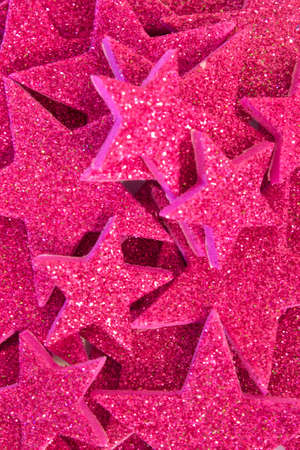 This is a photograph of Purple Glitter stars backgroundの写真素材