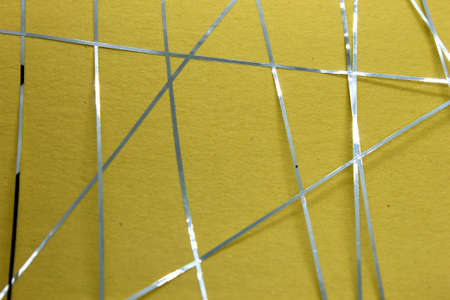 This is a photograph of a geometric design created using Blue tape applied onto a Yellow paper