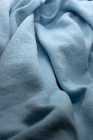 This is a photograph of Light Blue textured fabric background