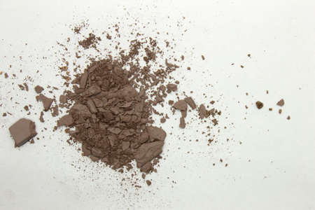 This is a photograph of a pale Brown matte powder Eyeshadow isolated on a White backgroundの写真素材