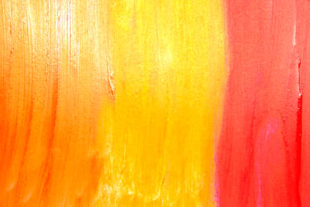 This is a photograph of three different shades of Orange, Yellow and Red Lipstick swatches gradient backgroundの写真素材