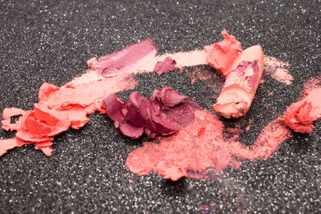 Lipstick swatches on a Black glittery background