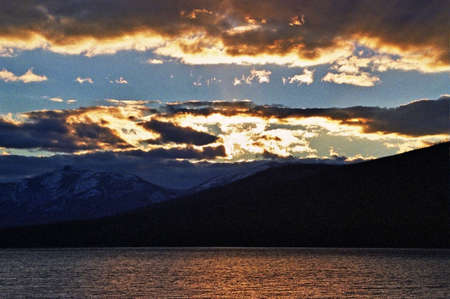 glacier lake with sunset cloudsの写真素材