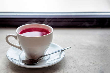 Cup of tea on a windowの写真素材
