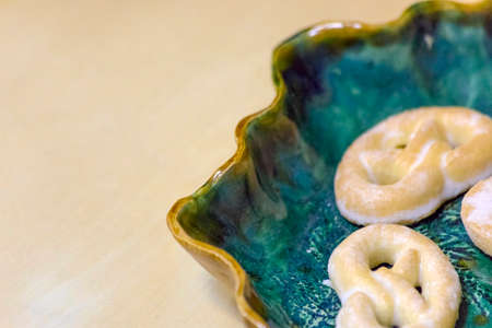 Handmade ceramic plate with several biscuits