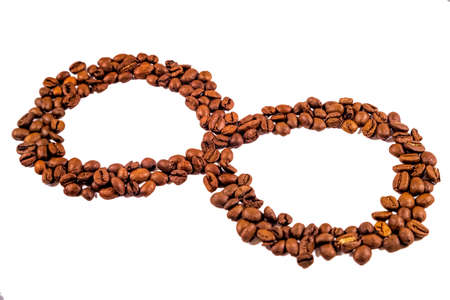 Isolated infinity sign made of coffee beans. Illustrating concept of everlasting aroma or eternal coffee.の写真素材