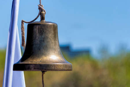 Memorial bell with wihte flag.の写真素材
