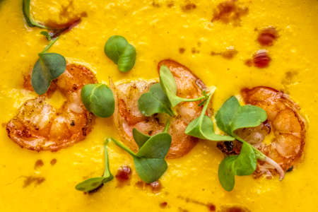 Tom yum soup with three shrimps on topの写真素材