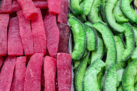 Variuos coulorful dried fruits on a market counterの写真素材