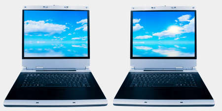 pair of screens with blue sky display