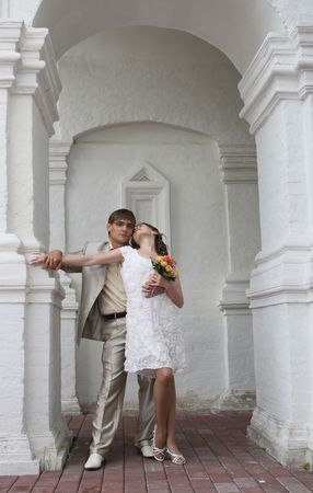 Newly-married couple on wedding walk in the cool afternoonの写真素材