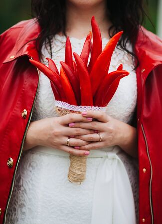 amazing wedding bouquet of red peppers at the weddingの写真素材